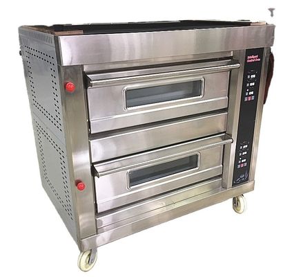 Le pain de noix de coco rondes est facilité à cuire avec une grande cuisinière à la boulangerie Pie Long Loaf